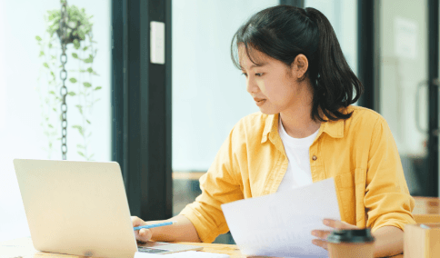 A linguist reviews a certified USCIS translation next to apostille-ready originals at Translation Services in Washington.