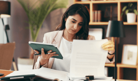 A project lead reviews a legal contract translation for accuracy, using Translation Services in Astoria before submission.