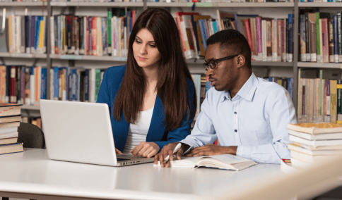 Two students check a certified transcript packet from Translation Services in Brooklyn before submitting it to a university.