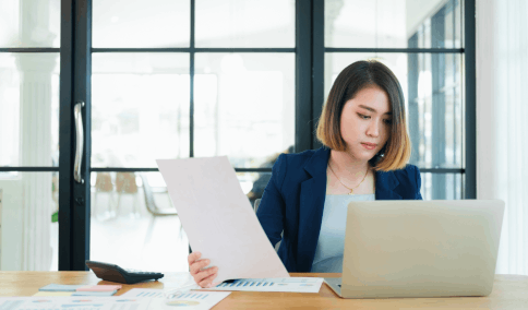 A certified translator preparing a Birth Certificate translation with a signed certification for legal purposes in NYC.