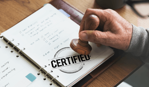 An agency team stamps a certified corporate document from Translation Services in Astoria before sending it to partners.