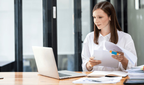 A project manager verifies regulatory terms, delivering Translation Services in Jackson Heights for certified business.