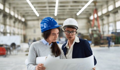 Technicians compare bilingual specifications at a workbench, using Translation Services in Chinatown for technical specs.