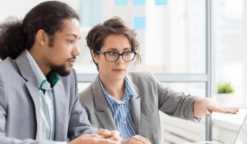 Two translators discusses common languages during Translation Services in Manhattan to assign the right linguist.