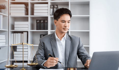 A lawyer marks up a contract while Haitian Creole Translation Services in New York City deliver a matched legal version.