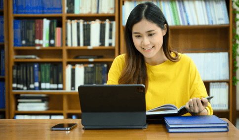 A student reviews a transcript draft as French Translation Services in New York City format an academic submission packet.