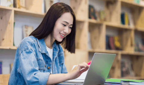 A student checks a certified transcript packet prepared with Spanish Translation Services in New York City for academic use.