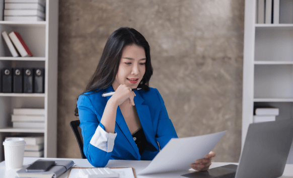 A certified ATA linguist checks a stamped contract, delivering Spanish Translation Services in New York City quickly.