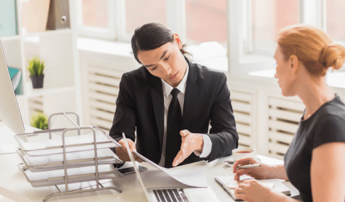 A buyer reviews a purchase contract with Korean Translation Services in New York City for a real estate closing.