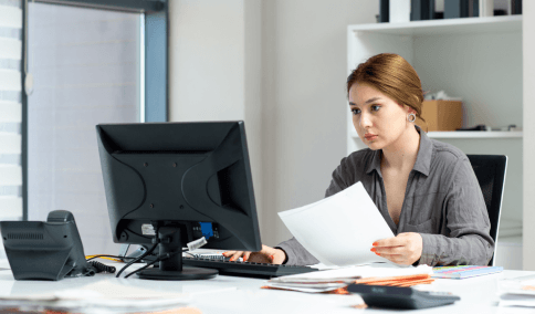 A client reviews a translated purchase contract, using Spanish Translation Services in New York City for real estate.