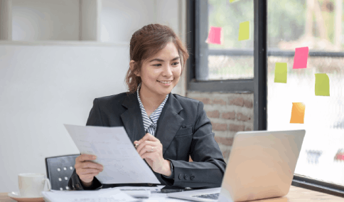 Professional translator helping a customer prepare their translated Birth Certificate for official New York City procedures.
