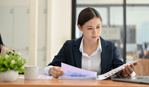 A translator matches stamps and formatting on pleadings using Spanish Translation Services in New York City for legal use.