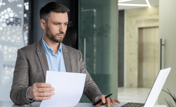 A project manager reviews a final checklist for error-free documentation using Translation Services in Astoria on a laptop.