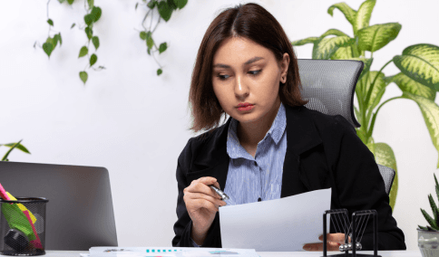A translator assembles a USCIS packet as French Translation Services in New York City prepare certified pages.