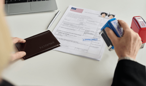 A translator stamps USCIS forms for Chinese Translation Services in New York City to prepare certified packets.