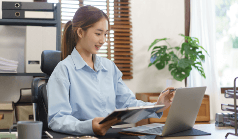 A client requests a free quote for USCIS certified documents using Translation Services in Astoria on a laptop.
