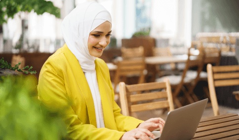 A translator assembles a USCIS packet and certification page, providing Arabic Translation Services in New York City.