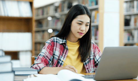 A student checks a diploma packet using Translation Services in Williamsburg for academic records needed for college.